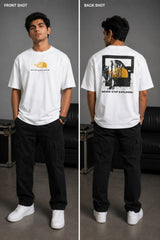 Man wearing FROM THE NORTH oversized t-shirt in beige with black cargo pants and white sneakers. Features The North Face logo and graphic on front and back.