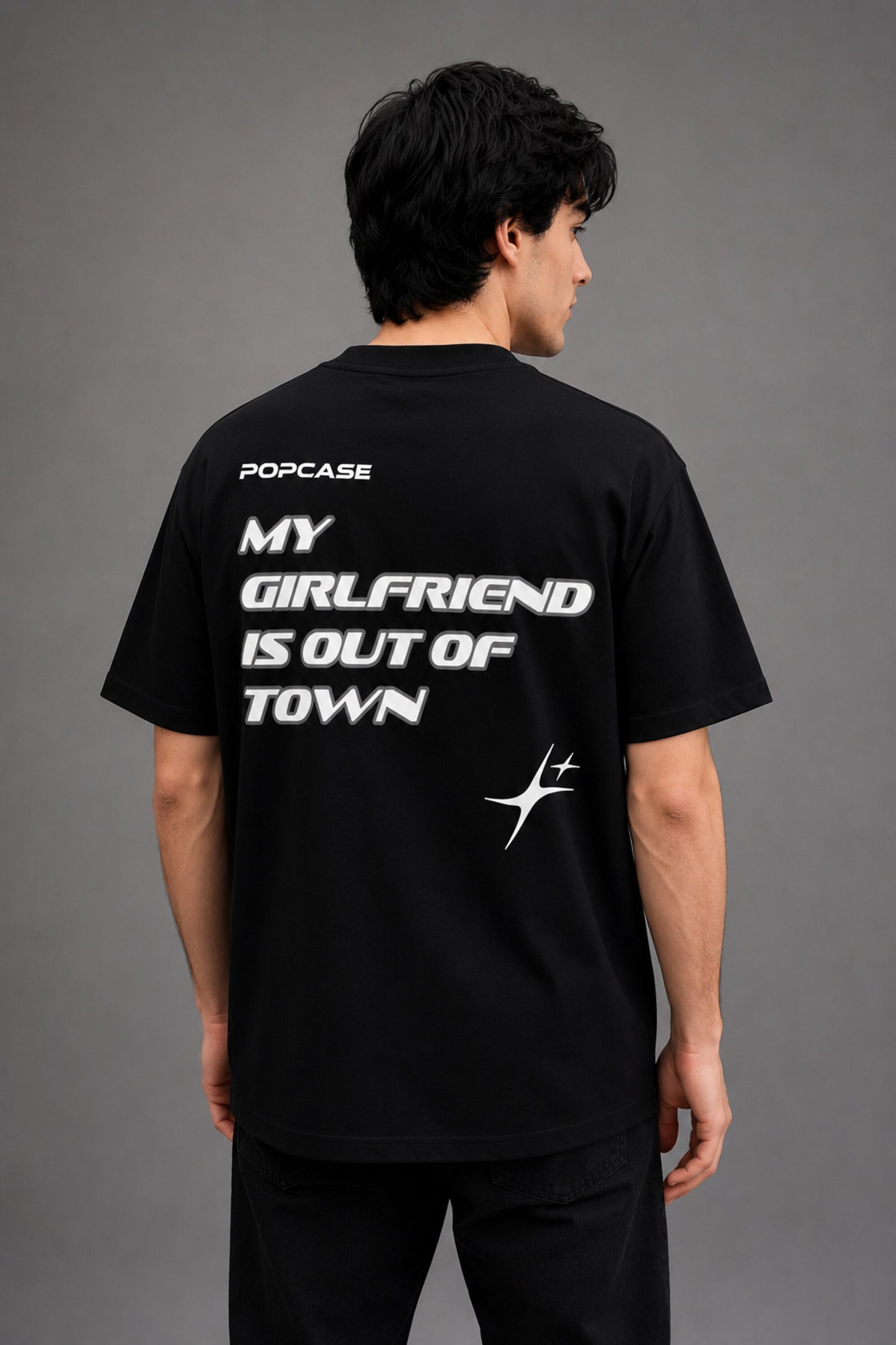 Black QUICKE oversized t-shirt featuring bold white graphic print on the chest and back. Showcasing premium fabric details and relaxed fit. - black