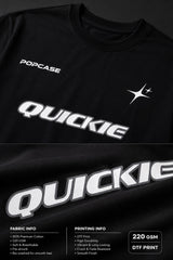 Black QUICKE oversized t-shirt featuring bold white graphic print on the chest and back. Showcasing premium fabric details and relaxed fit.