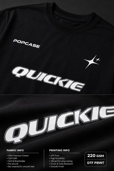 Black QUICKE oversized t-shirt featuring bold white graphic print on the chest and back. Showcasing premium fabric details and relaxed fit.