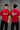 Black QUICKE oversized t-shirt featuring bold white graphic print on the chest and back. Showcasing premium fabric details and relaxed fit. - red
