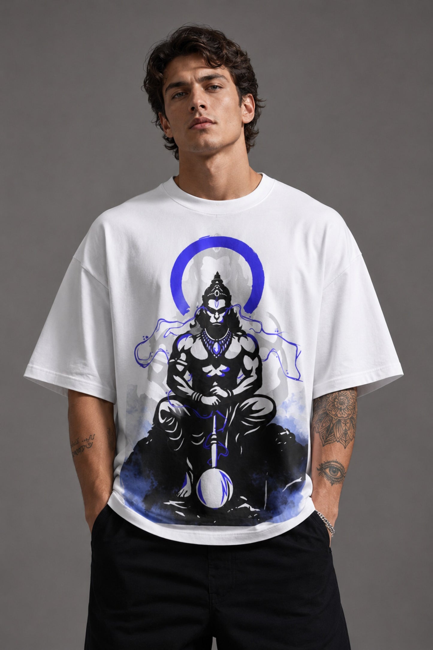 White oversized t-shirt featuring a striking black and blue graphic of Hanuman Dada, with a large blue halo. Designed for a relaxed, streetwear fit. - white