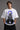 White oversized t-shirt featuring a striking black and blue graphic of Hanuman Dada, with a large blue halo. Designed for a relaxed, streetwear fit. - white