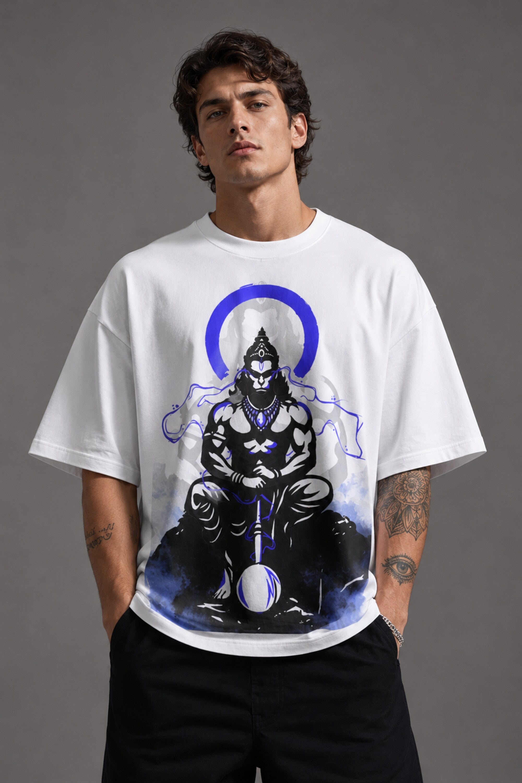 White oversized t-shirt featuring a striking black and blue graphic of Hanuman Dada, with a large blue halo. Designed for a relaxed, streetwear fit. - white