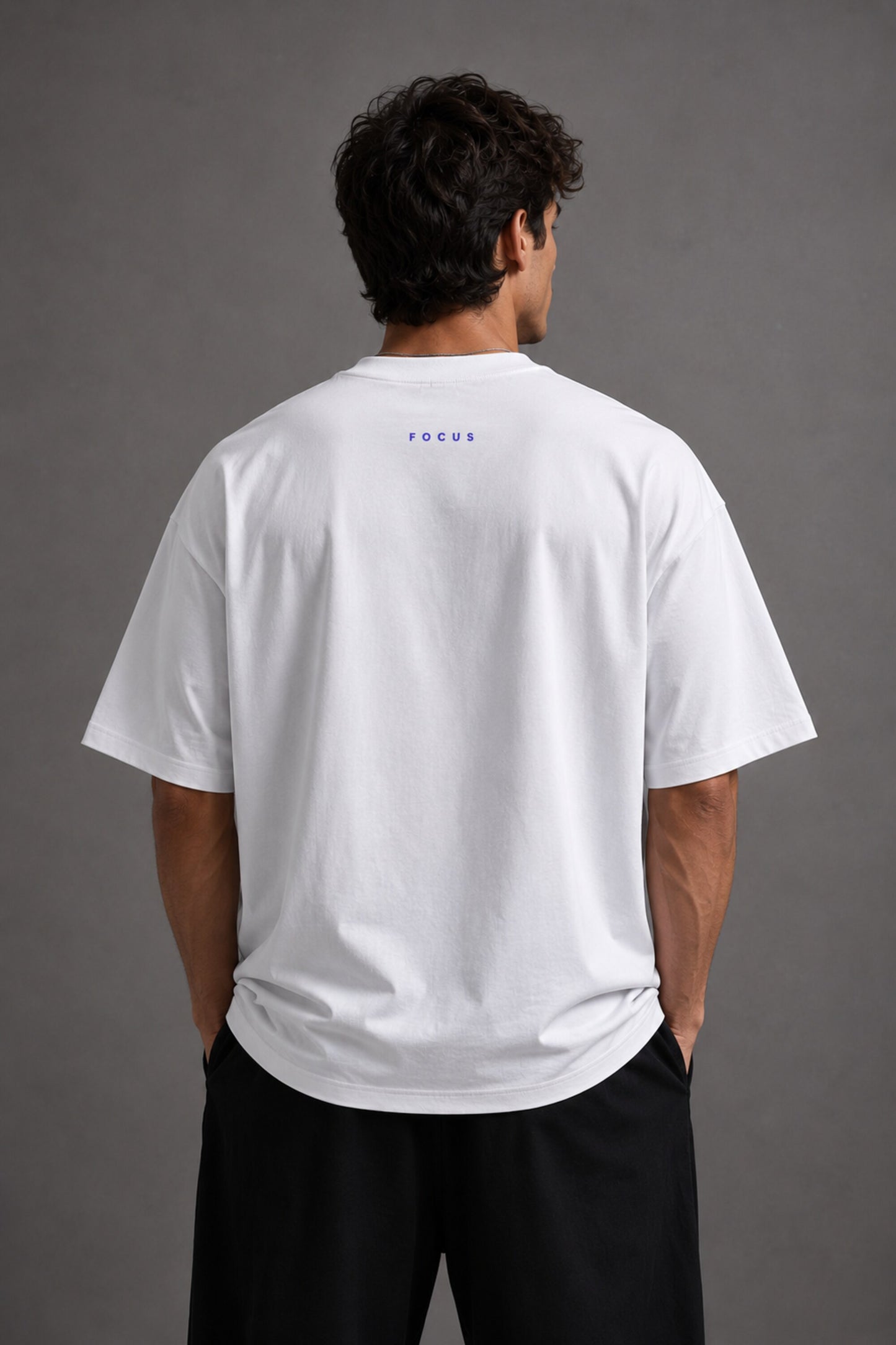 White oversized t-shirt featuring a striking black and blue graphic of Hanuman Dada, with a large blue halo. Designed for a relaxed, streetwear fit.