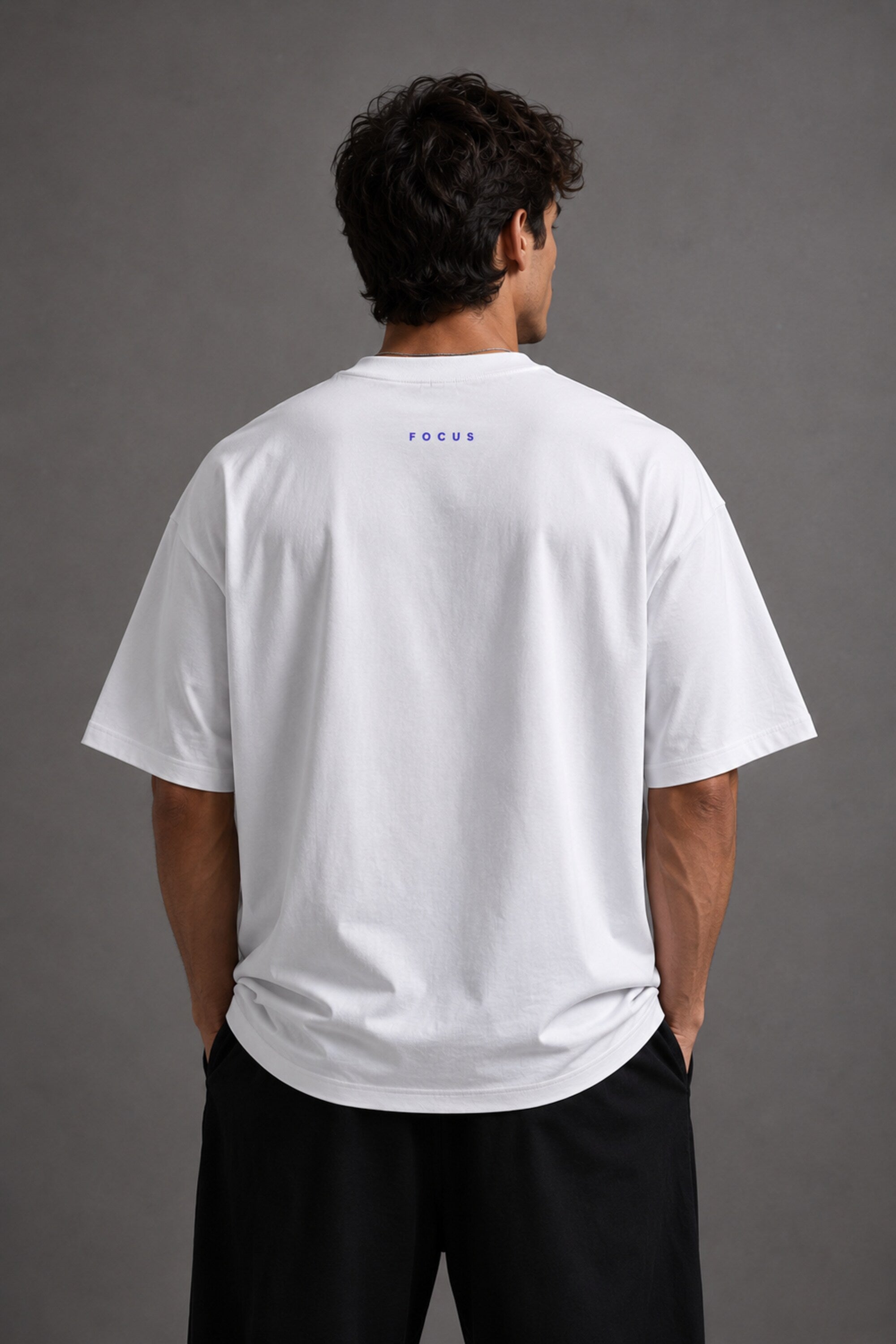 White oversized t-shirt featuring a striking black and blue graphic of Hanuman Dada, with a large blue halo. Designed for a relaxed, streetwear fit.