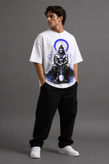White oversized t-shirt featuring a striking black and blue graphic of Hanuman Dada, with a large blue halo. Designed for a relaxed, streetwear fit.