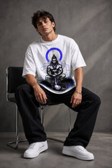 White oversized t-shirt featuring a striking black and blue graphic of Hanuman Dada, with a large blue halo. Designed for a relaxed, streetwear fit.