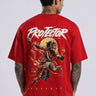 Red oversized t-shirt with 'PROJECTOR HANUMANJI' graphic design of a warrior monkey god and 'POPCASE' logo, worn by a man.