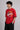 Model wearing a black oversized t-shirt with a vintage Hot Wheels graphic and flames. The tee has a relaxed fit and is paired with black pants.