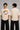 Model wearing a black oversized t-shirt with a vintage Hot Wheels graphic and flames. The tee has a relaxed fit and is paired with black pants. - beige