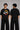 Model wearing a black oversized t-shirt with a vintage Hot Wheels graphic and flames. The tee has a relaxed fit and is paired with black pants.