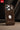 Brown leather phone case with Apple logo on a dark background
