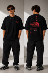 Model wearing a white POP-FROM-THE-NORTH oversized t-shirt with a small red logo on the chest, styled with black cargo pants, showcasing a relaxed streetwear fit. - black