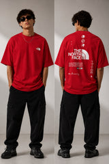 Model wearing a white POP-FROM-THE-NORTH oversized t-shirt with a small red logo on the chest, styled with black cargo pants, showcasing a relaxed streetwear fit. - red