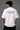 White POPCASE oversized tshirt with i'm not cristiano ronaldo but i also hate losing quote in navy on back, POPCASE Since 2022 tagline