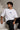 White POPCASE oversized tshirt with i'm not cristiano ronaldo but i also hate losing quote in navy on back, POPCASE Since 2022 tagline