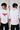 Person wearing a white t-shirt with red graphic design on front and 'Venom' text on back, standing against a plain background.