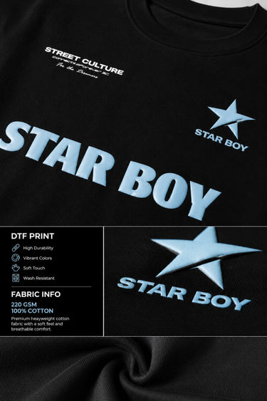 Black STAR BOY oversized t-shirt with a light blue raised graphic of a star and text. Detailed fabric texture shown.