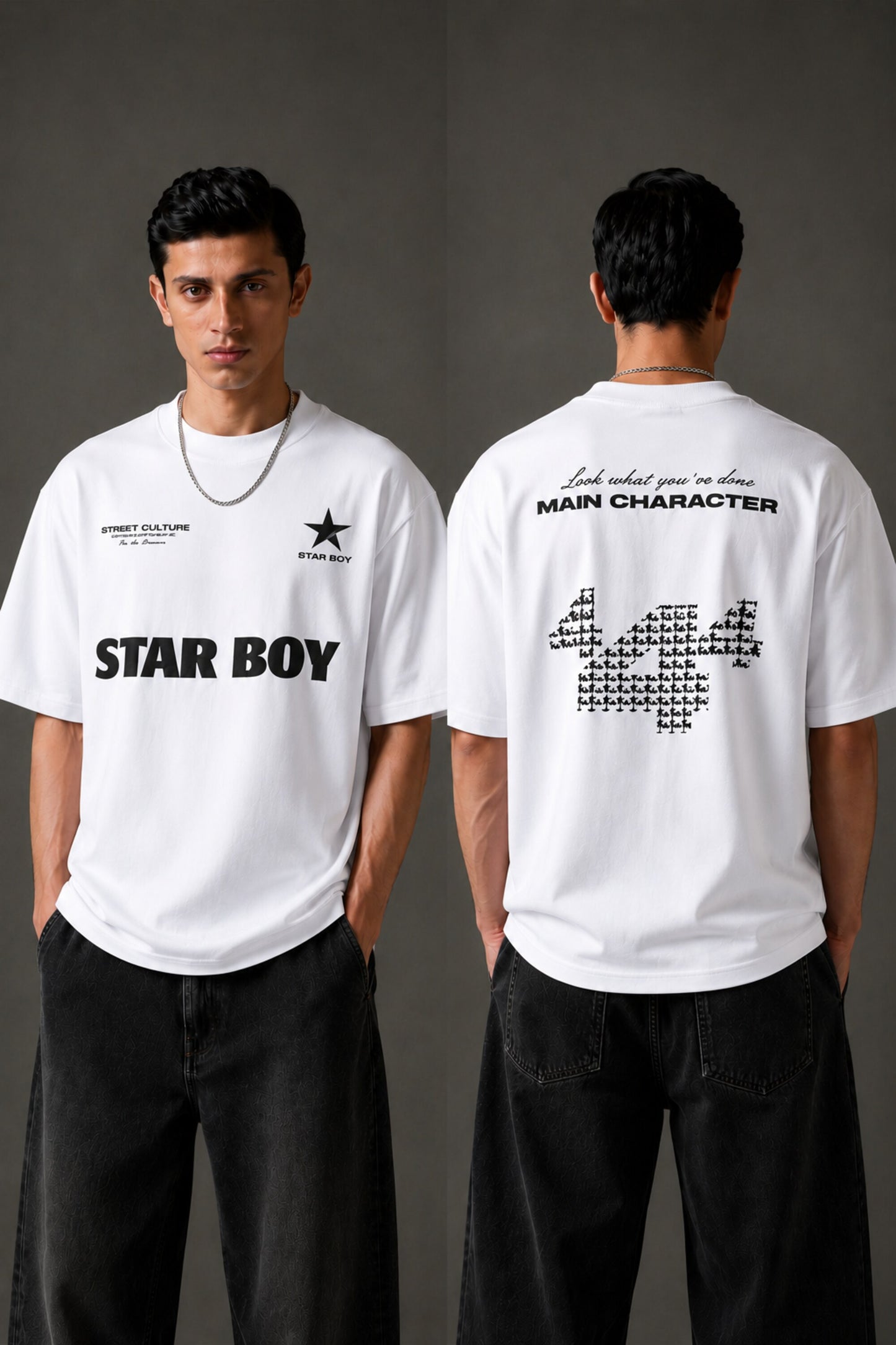 Black STAR BOY oversized t-shirt with a light blue raised graphic of a star and text. Detailed fabric texture shown. - white