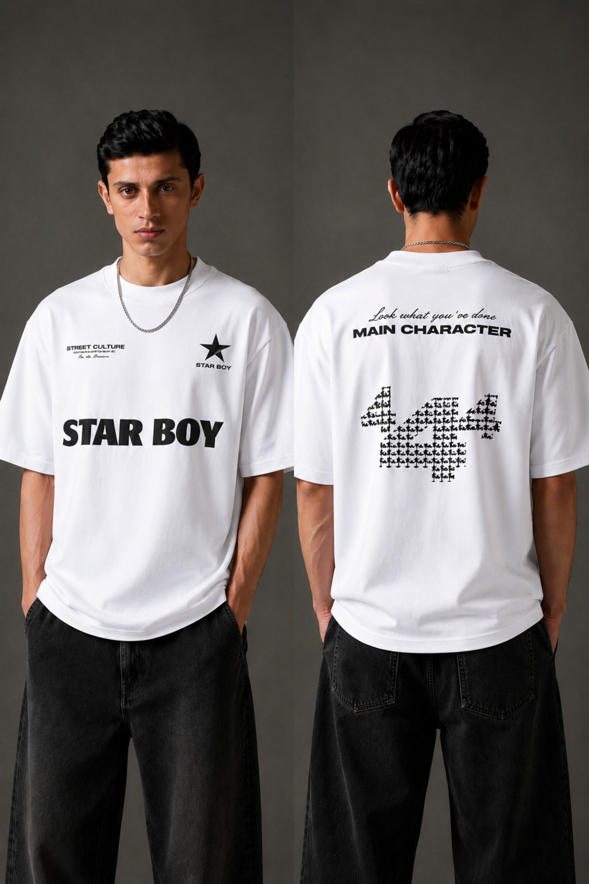 Black STAR BOY oversized t-shirt with a light blue raised graphic of a star and text. Detailed fabric texture shown. - white