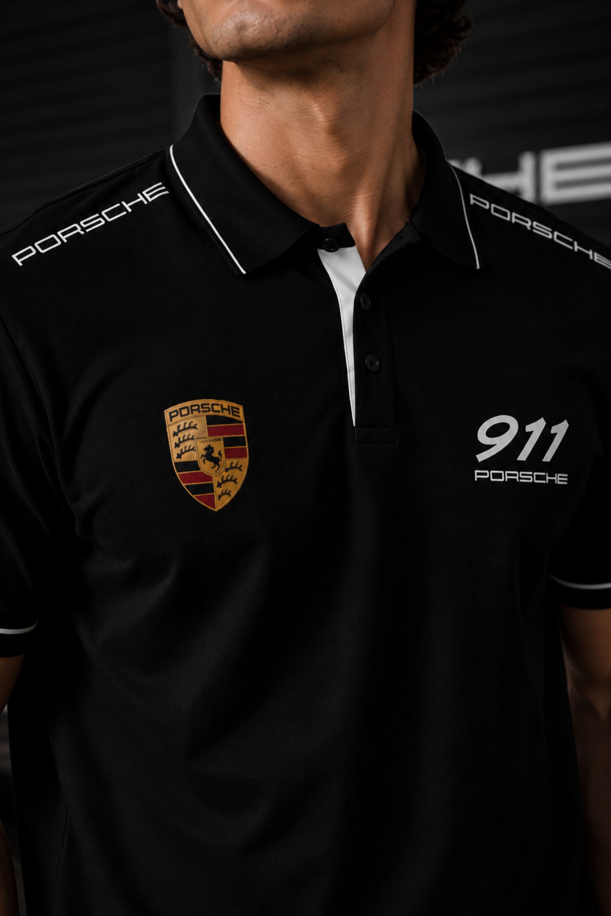 Black Porsche 911 polo t-shirt with Porsche crest badge, 911 text and PORSCHE shoulder panel branding, motorsport India