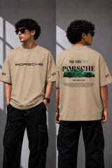 Beige oversized t-shirt featuring a vibrant green Porsche 911 RS RAWK graphic and 'Drifting Club' text. Mockup highlighting premium cotton fabric and stitching details.