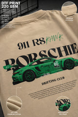 Beige oversized t-shirt featuring a vibrant green Porsche 911 RS RAWK graphic and 'Drifting Club' text. Mockup highlighting premium cotton fabric and stitching details.