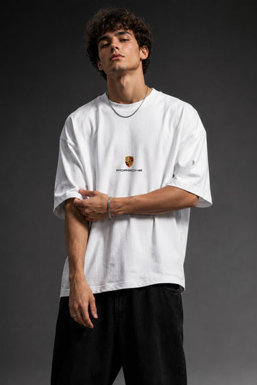 Person wearing a white t-shirt with a logo on a dark background