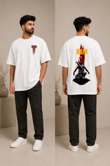 Model wearing a beige RAM oversized t-shirt with a red graphic print on the chest, paired with dark trousers and white sneakers. Showcases streetwear style and premium comfort. - white