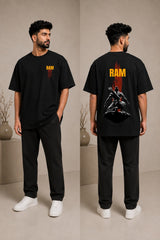 Model wearing a beige RAM oversized t-shirt with a red graphic print on the chest, paired with dark trousers and white sneakers. Showcases streetwear style and premium comfort. - black