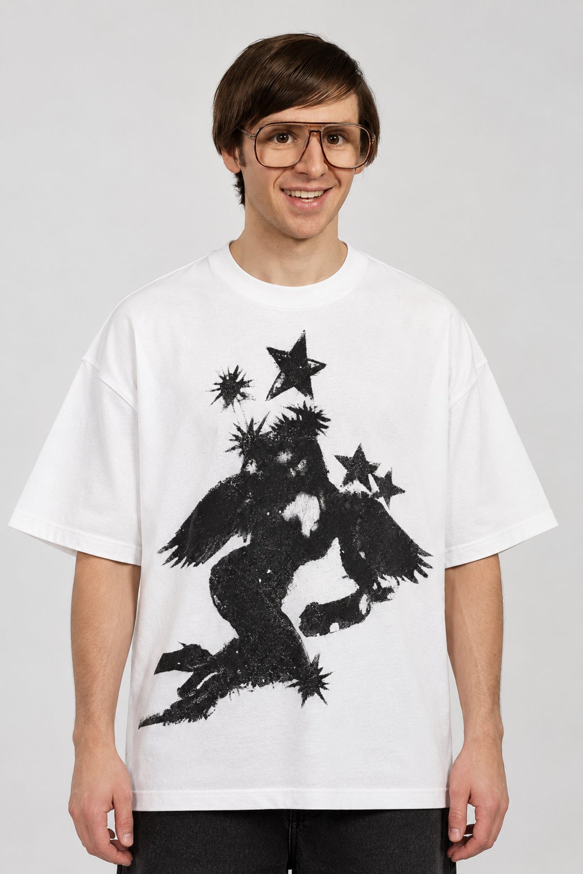 White oversized tshirt with massive black cosmic spiral vortex and falling figure on back, drop shoulder boxy fit, men India