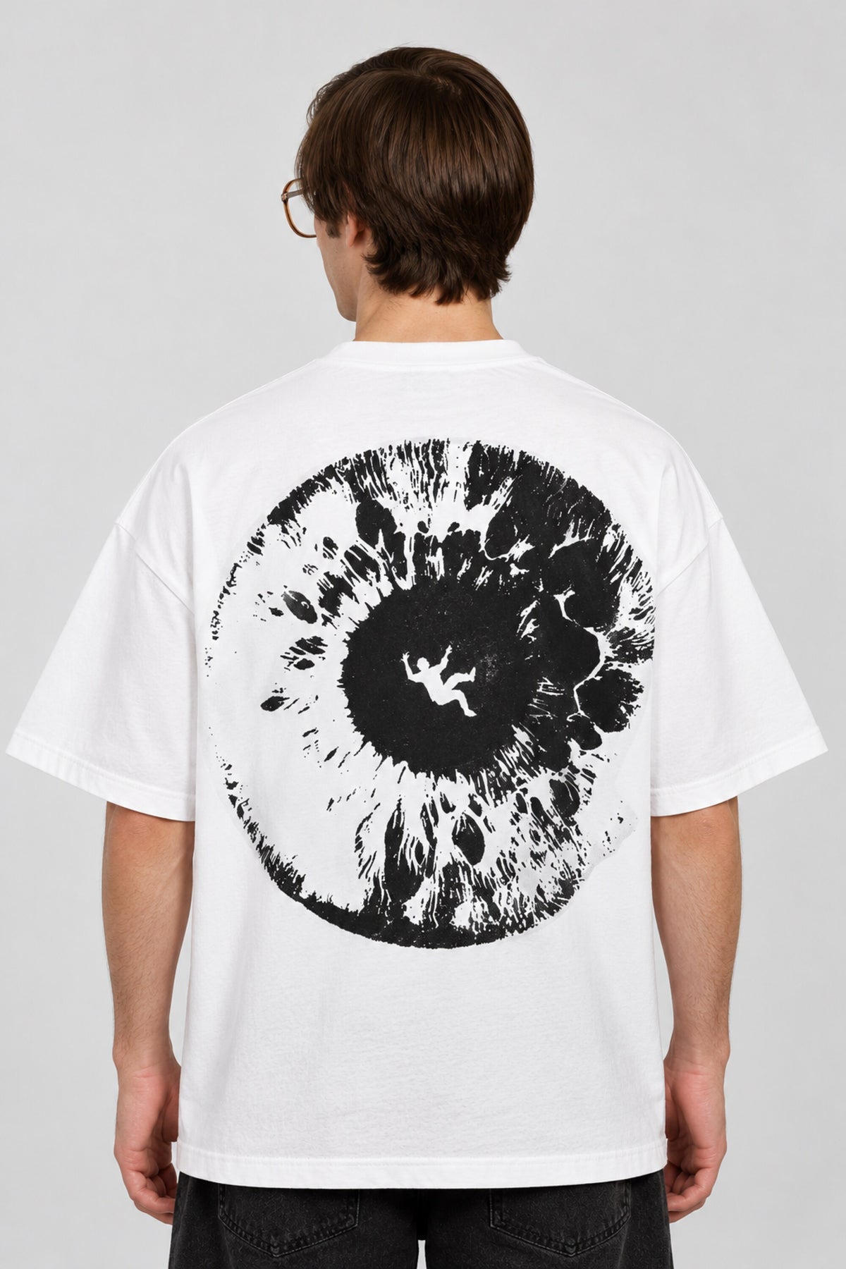 White oversized tshirt with massive black cosmic spiral vortex and falling figure on back, drop shoulder boxy fit, men India