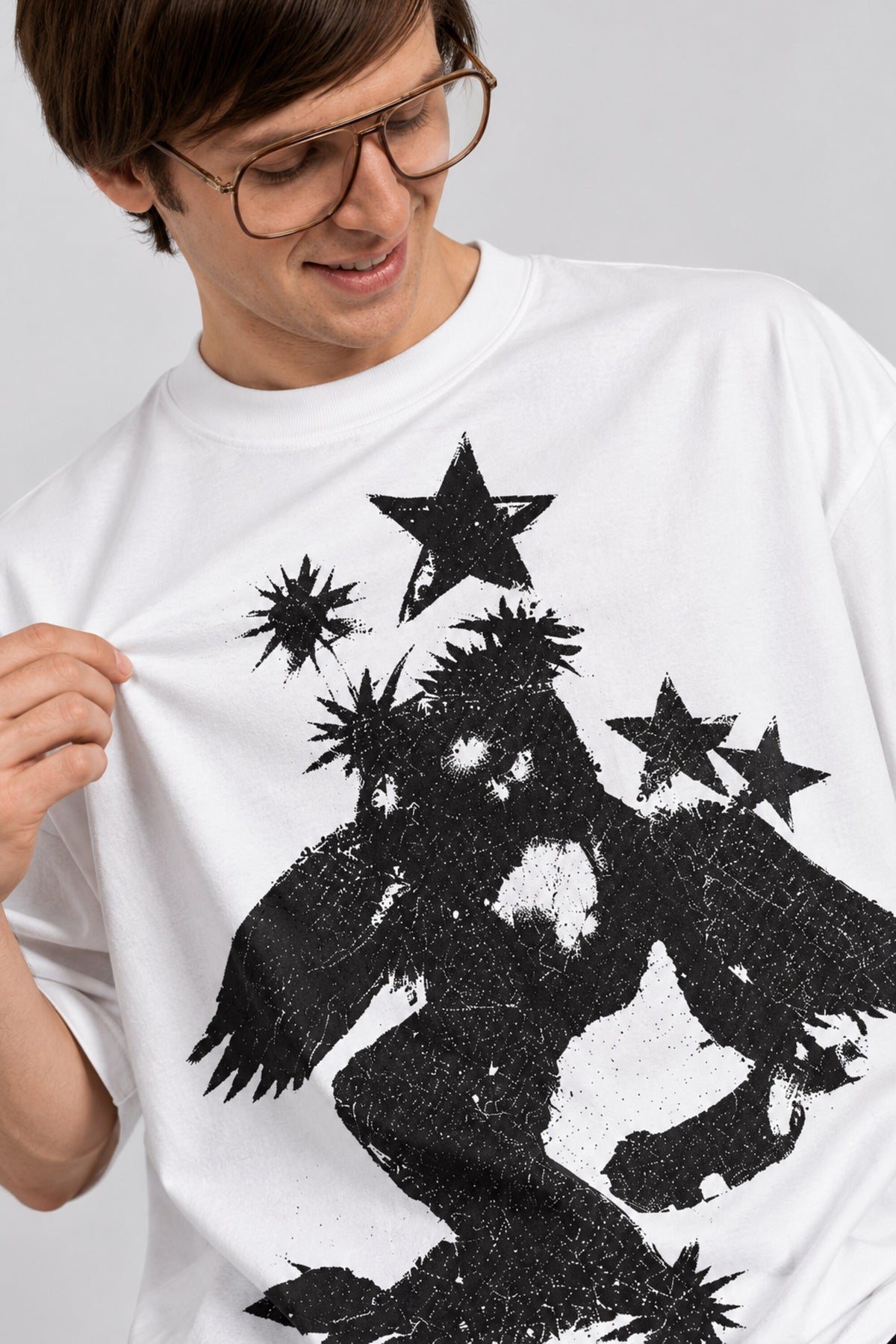 White oversized tshirt with massive black cosmic spiral vortex and falling figure on back, drop shoulder boxy fit, men India