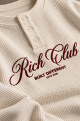 Cream waffle full sleeve boxy tshirt with Rich Club red cursive script print on chest, henley collar, men India