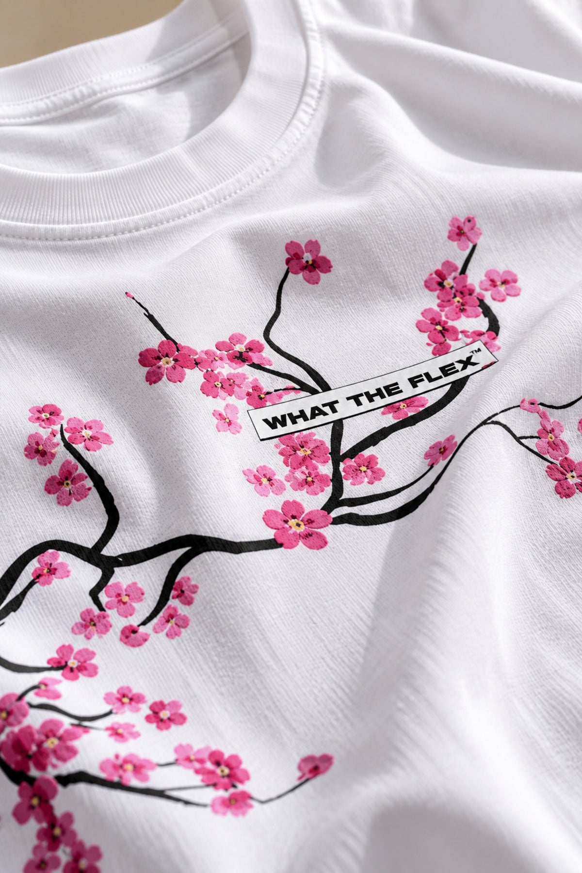 White oversized tshirt with detailed sakura cherry blossom branch in pink and red across chest, drop shoulder boxy fit, men India