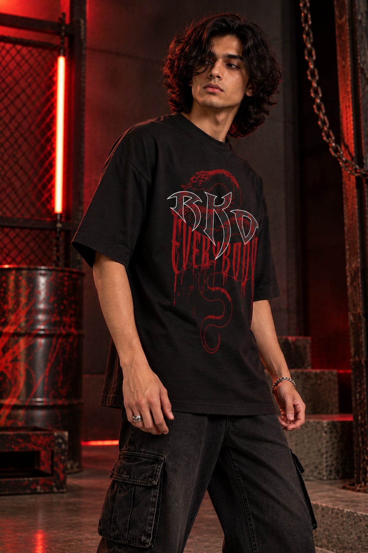 Black oversized tshirt with RKO white logo and Everybody dark red gothic text and snake on front, drop shoulder boxy fit, men India