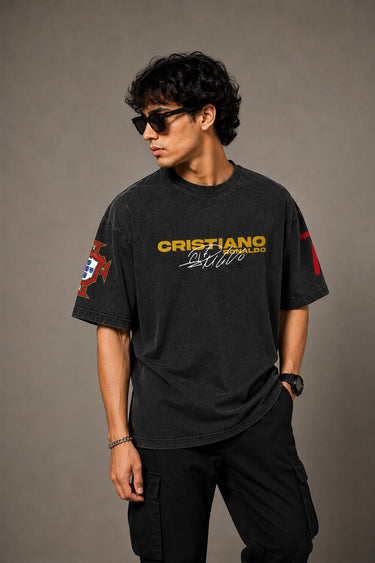 Model wearing a vintage wash dark blue oversized t-shirt with a graphic of Cristiano Ronaldo on the back and "CRISTIANO RONALDO" text on the front.