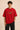 Red oversized t-shirt with "RESILIENCE" embroidered in gold and a green embroidered crocodile graphic. Features a ribbed neckline and premium stitching. - red