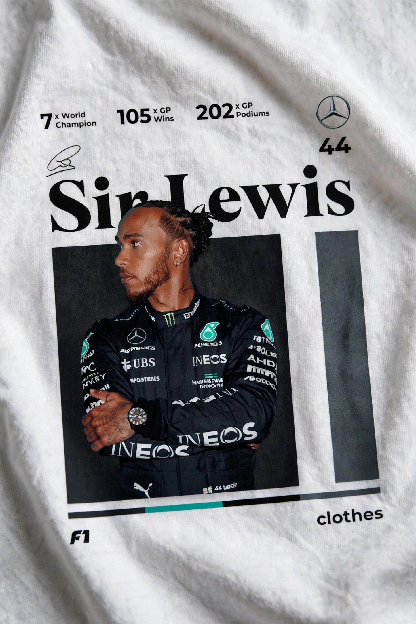 Model wearing white POPCASE Sir Lewis Hamilton oversized t shirt with Still We Rise 44 graphic and signature on chest