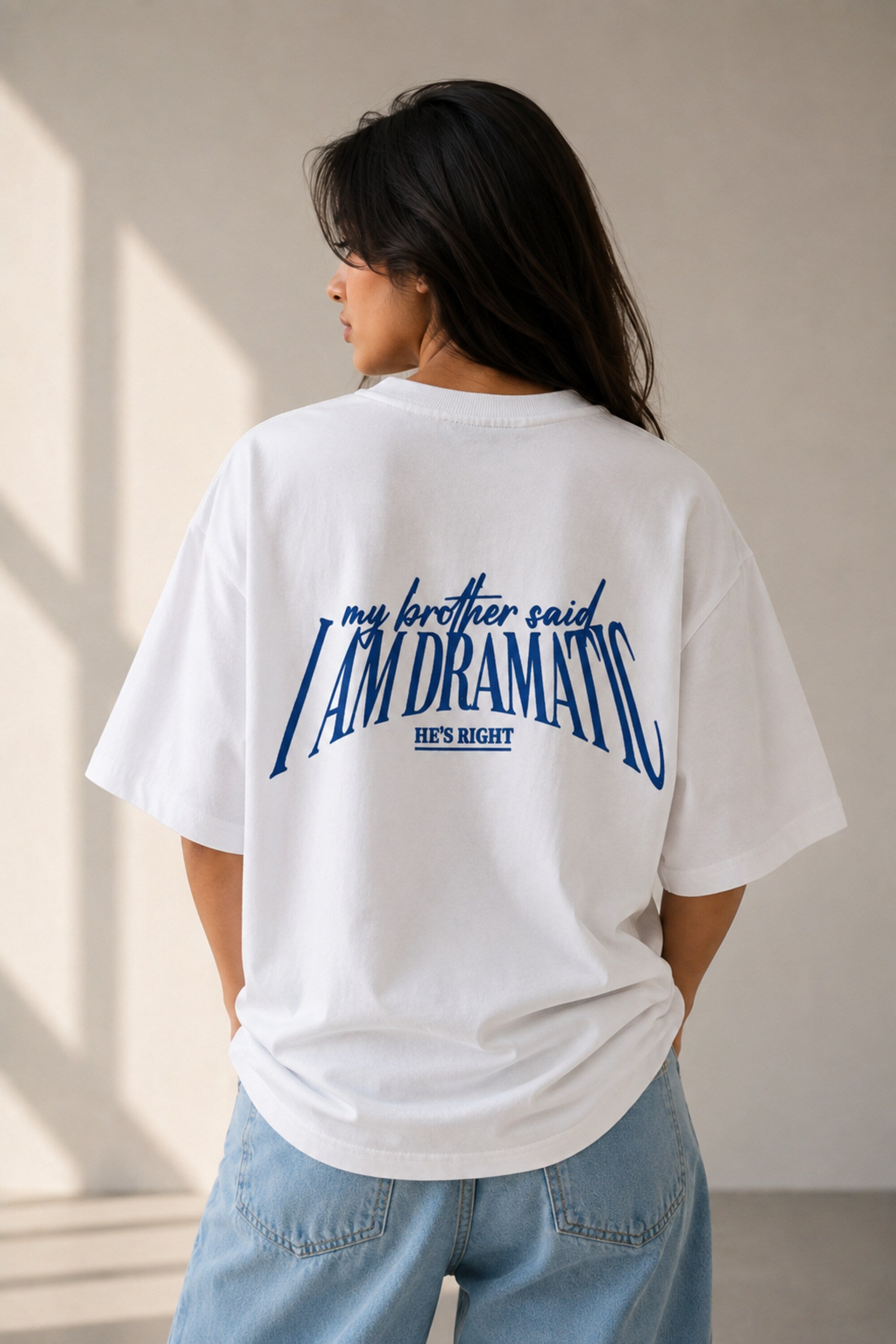 White oversized t-shirt with bold blue DRAMATIC varsity block text front print 220 GSM HD print oversized fit