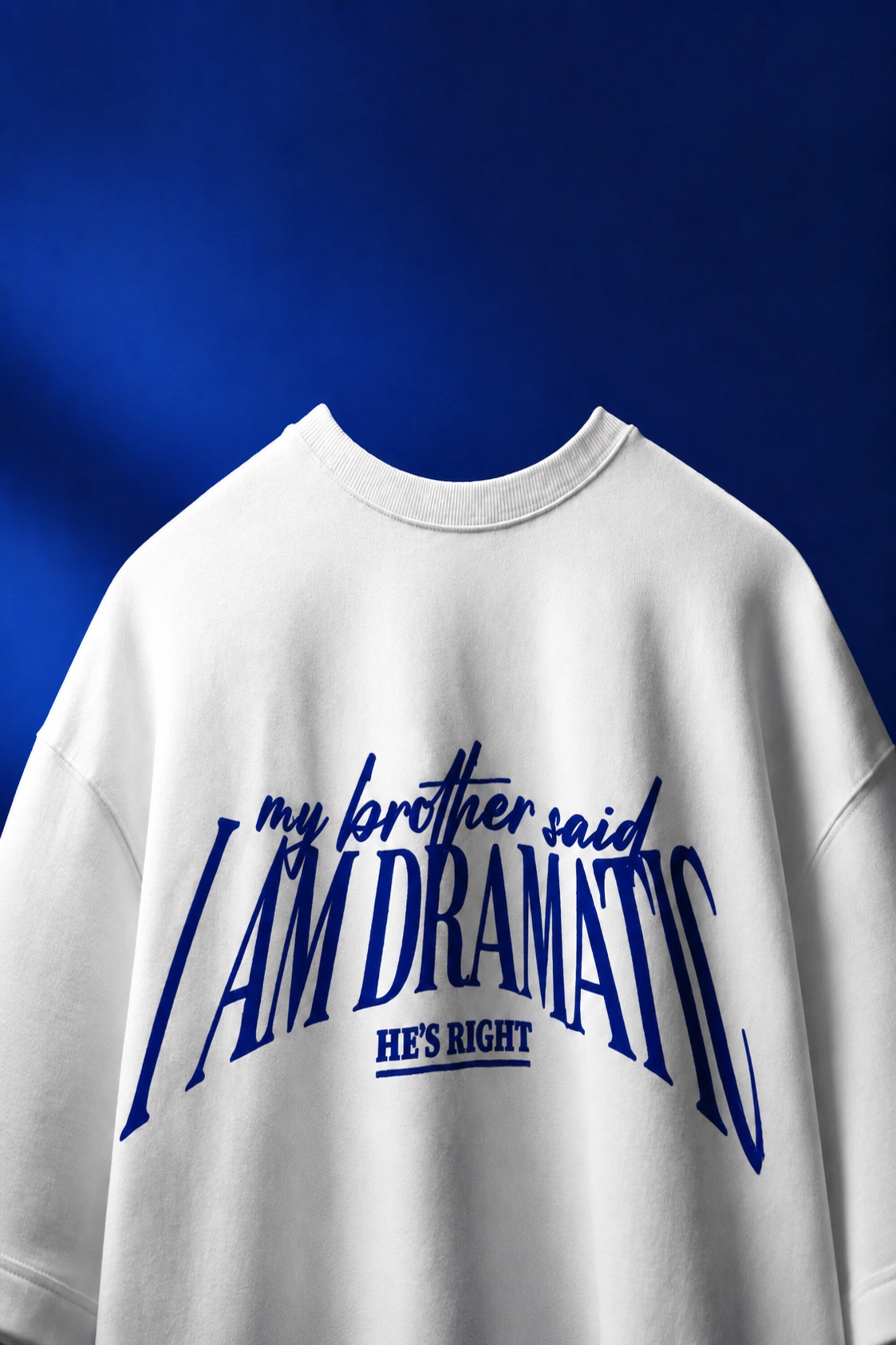 White oversized t-shirt with bold blue DRAMATIC varsity block text front print 220 GSM HD print oversized fit - white