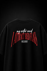 Black oversized t-shirt with my sister said I attract red flags she's right back print in red and white gothic arch text - black