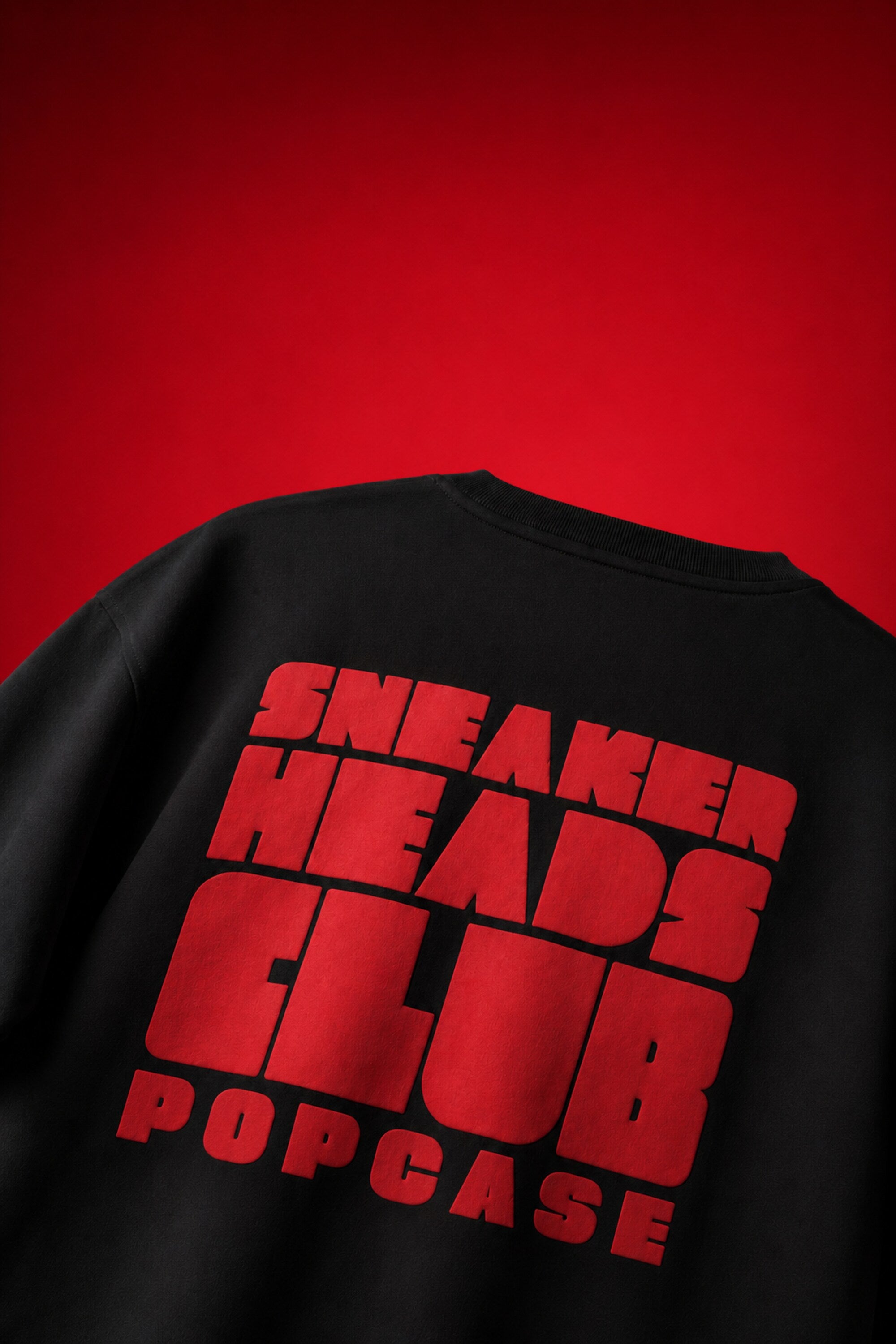 Black oversized t-shirt with Air Jordan 1 Bred sneaker chest graphic illustration