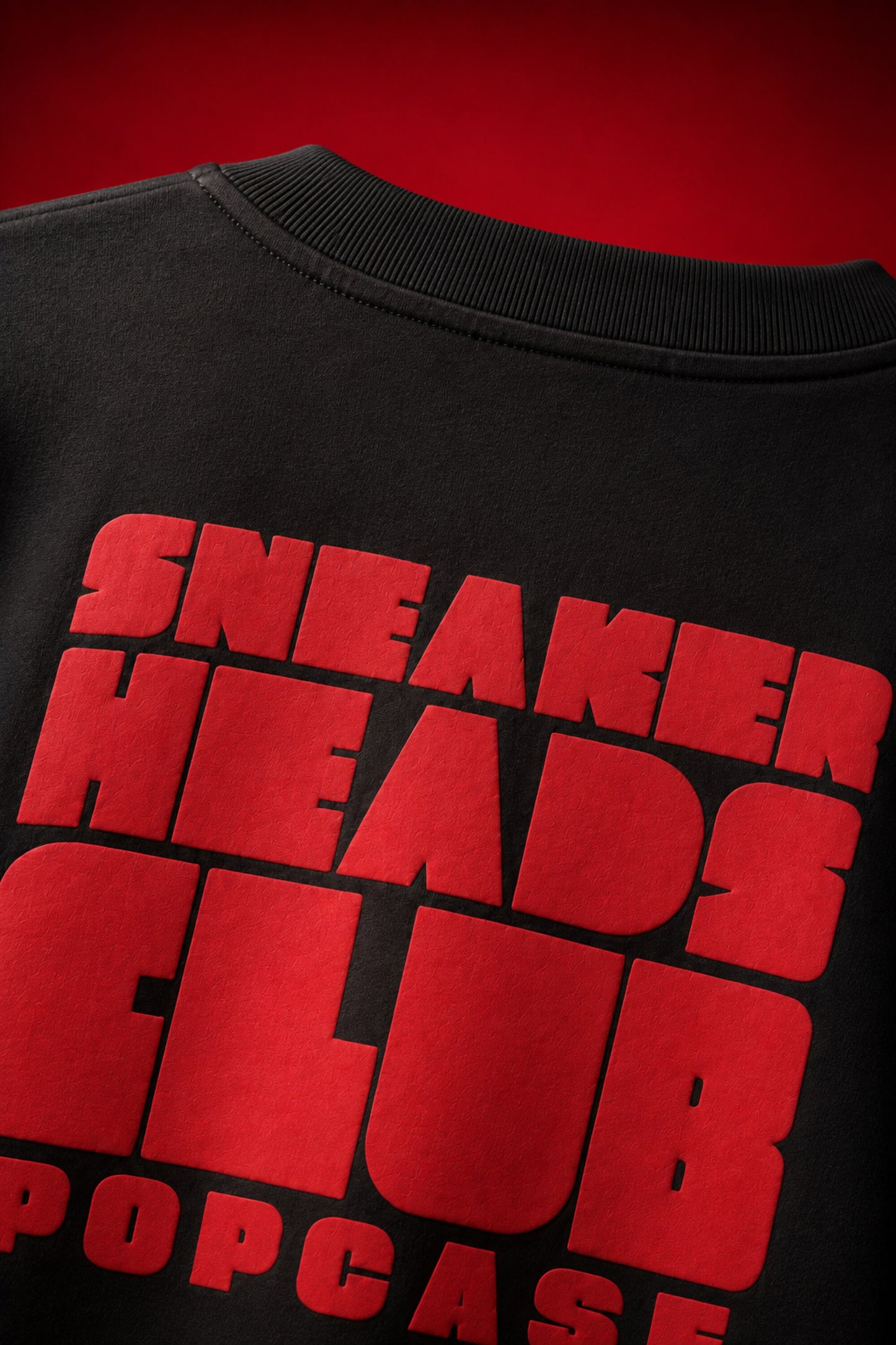 Black oversized t-shirt with Air Jordan 1 Bred sneaker chest graphic illustration