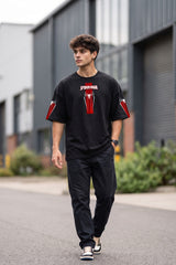 Black oversized tshirt with SPIDER-MAN text and red spider cross icon on chest and red sleeve panels, drop shoulder boxy fit, men India
