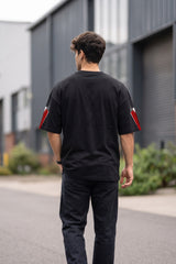 Black oversized tshirt with SPIDER-MAN text and red spider cross icon on chest and red sleeve panels, drop shoulder boxy fit, men India