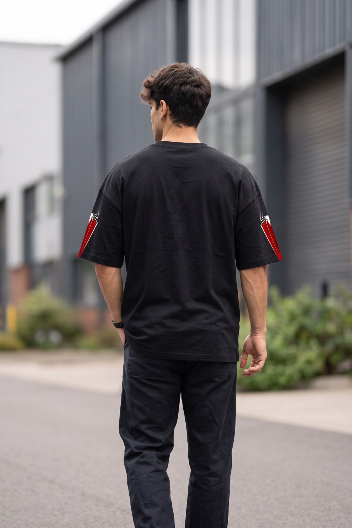 Black oversized tshirt with SPIDER-MAN text and red spider cross icon on chest and red sleeve panels, drop shoulder boxy fit, men India