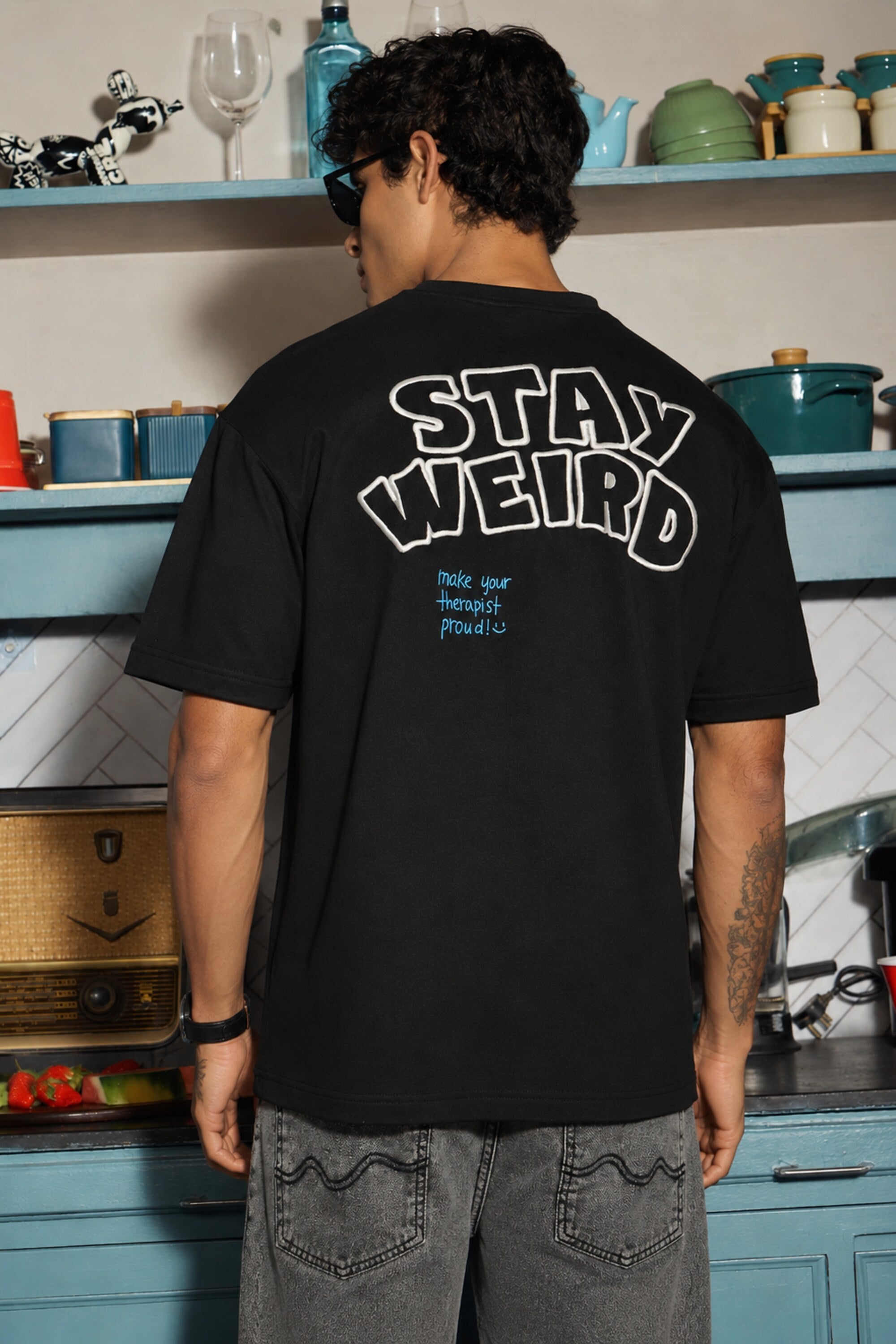 POPCASE Stay Weird black oversized graphic t shirt with skeleton guitarist and graffiti print streetwear