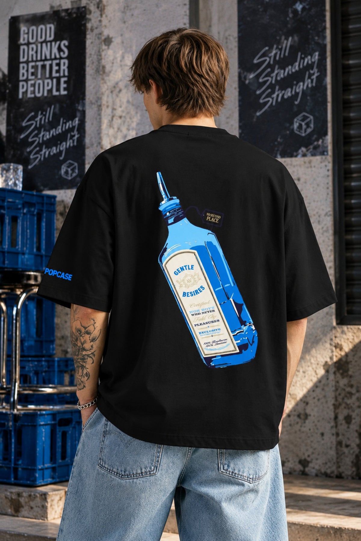 Black oversized tshirt with Still Standing Straight white cursive script and blue accent on chest, drop shoulder boxy fit, men India